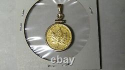 1984 1/10 oz Gold Maple Leaf. 9999 Fine Gold Mounted in Bezel Cleaned Worn 82721